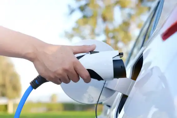 Man charging an electric car.