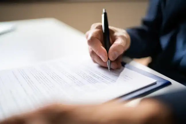 Man signing a contract